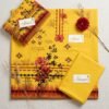 Japanese Imported Cotrai 3-piece unstitched suit in mustard yellow with printed floral shirt, warm cotrai shawl, and plain trouser