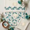 Japanese Imported Cotrai 3-piece unstitched suit in off-white featuring teal floral printed shirt, matching cotrai shawl, and plain trouser