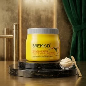 BREMOD Keratin Rejuvenating Hair Mask 500ml yellow jar on luxury dark marble podium from Chaudhary Superstore