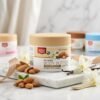 Golden Pearl Skin Therapy Body Butter Almond & Vanilla 200ml round white jar with beige lid on marble podium — Chaudhary Superstore