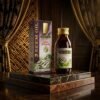 Hemani 100% Natural Neem Oil 60ml amber glass bottle and box packaging on luxury marble podium from Chaudhary Superstore