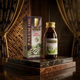 Hemani 100% Natural Neem Oil 60ml amber glass bottle and box packaging on luxury marble podium from Chaudhary Superstore