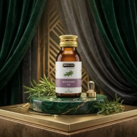 Hemani 100% Natural Rosemary Oil 30ml amber glass bottle on green marble stand from Chaudhary Superstore