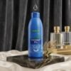 Hemani Coconut Oil 100% Natural 100ml blue bottle on luxury black marble display stand from Chaudhary Superstore