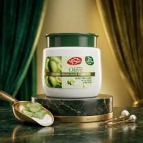 Lifebuoy Herbal Olive Pre-Wash Hair Mask With Aloe Vera & Milk Protein 650ml white tub jar with green lid on luxury dark green marble podium from Chaudhary Superstore