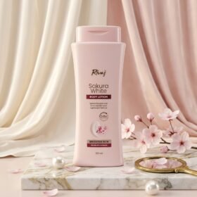 Rivaj Sakura White Body Lotion 200ml soft pink bottle on marble podium — Chaudhary Superstore
