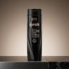 Sunsilk Black Shine Shampoo 185ml dark bottle on a sleek black marble surface from Chaudhary Superstore