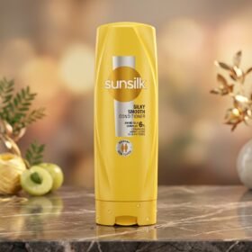 Sunsilk Silky Smooth Conditioner 180ml yellow bottle displayed on a luxury marble surface with botanical accents by Chaudhary Superstore