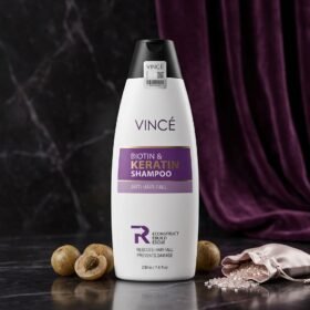 Vincé Biotin & Keratin Shampoo Anti Hair-Fall 230ml bottle displayed on a luxury studio marble surface from Chaudhary Superstore